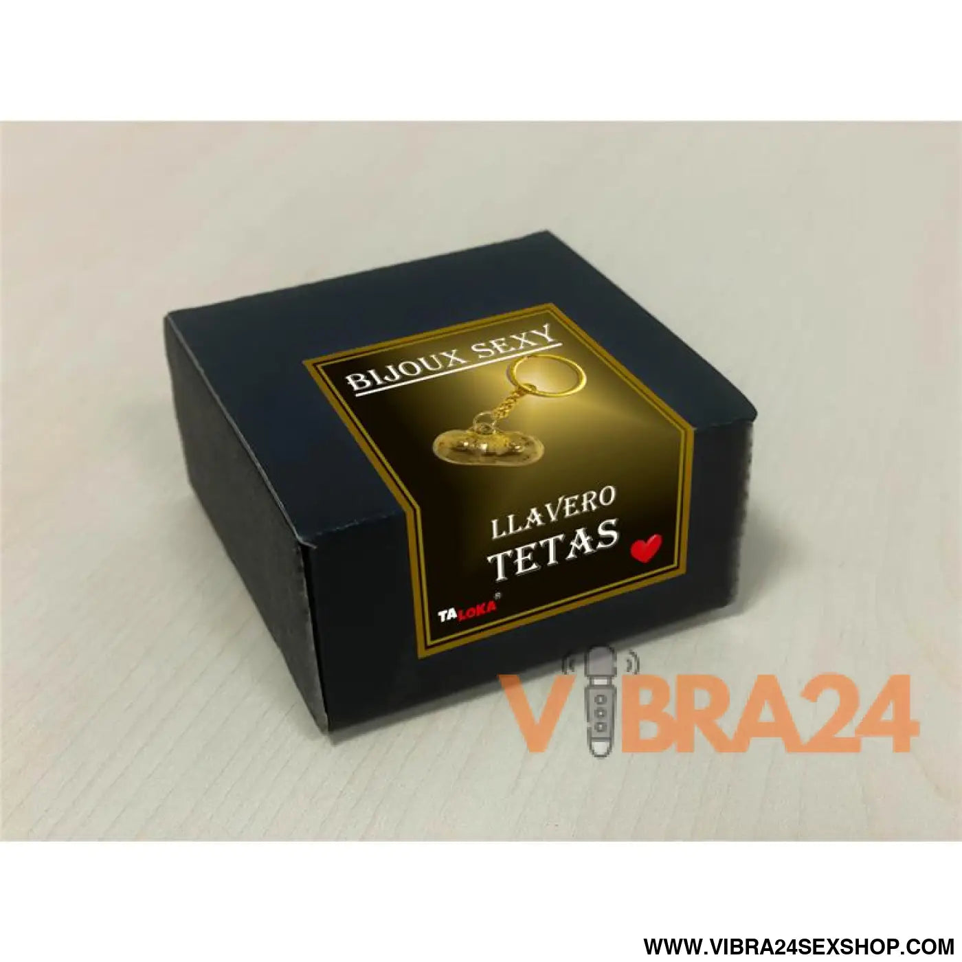Golden keychain in the shape of breast
