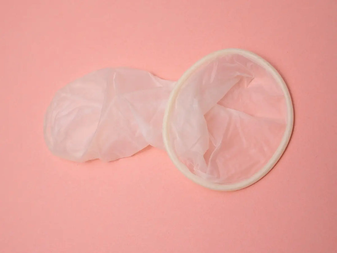 a pink surface with a pair of gloves on top of it