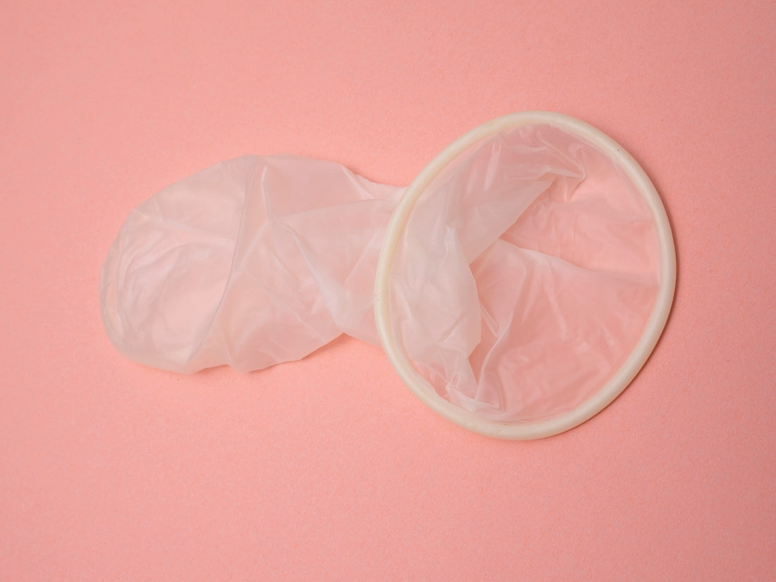 a pink surface with a pair of gloves on top of it